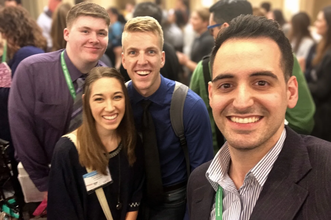 Jonathan Tureau, right, with fellow attendees at a recruiting conference.